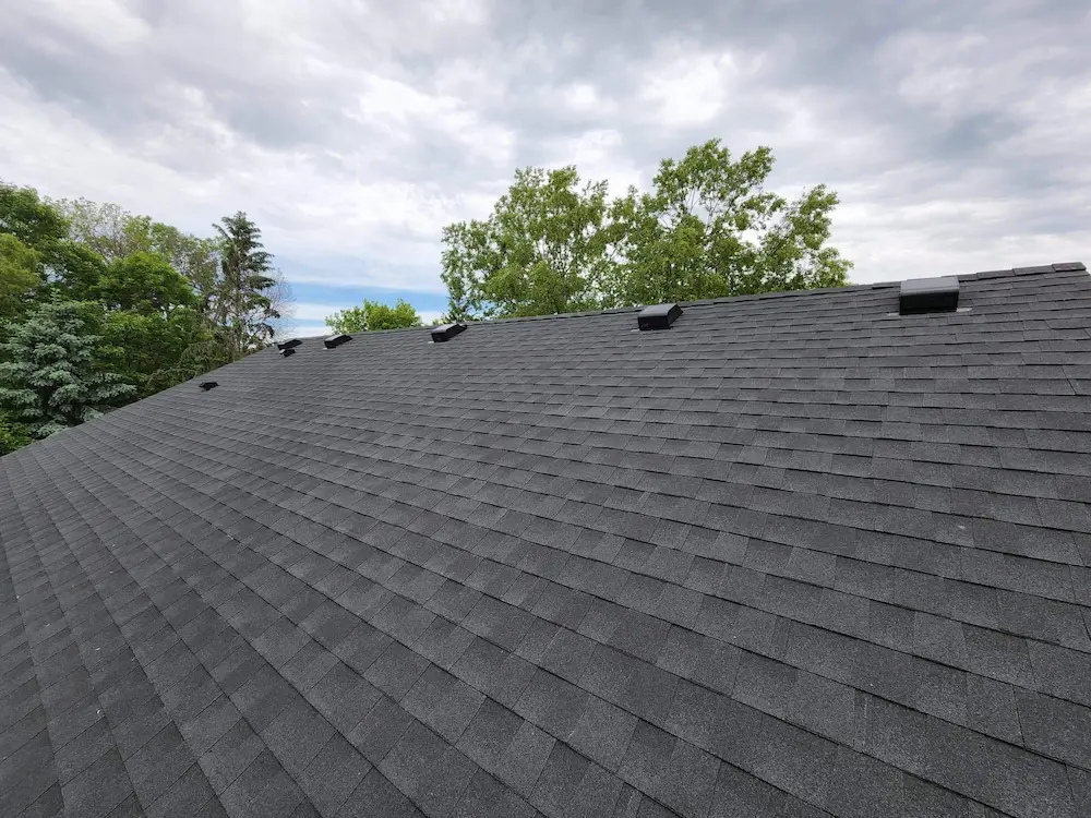 A roof that has been covered with asphalt shingles.